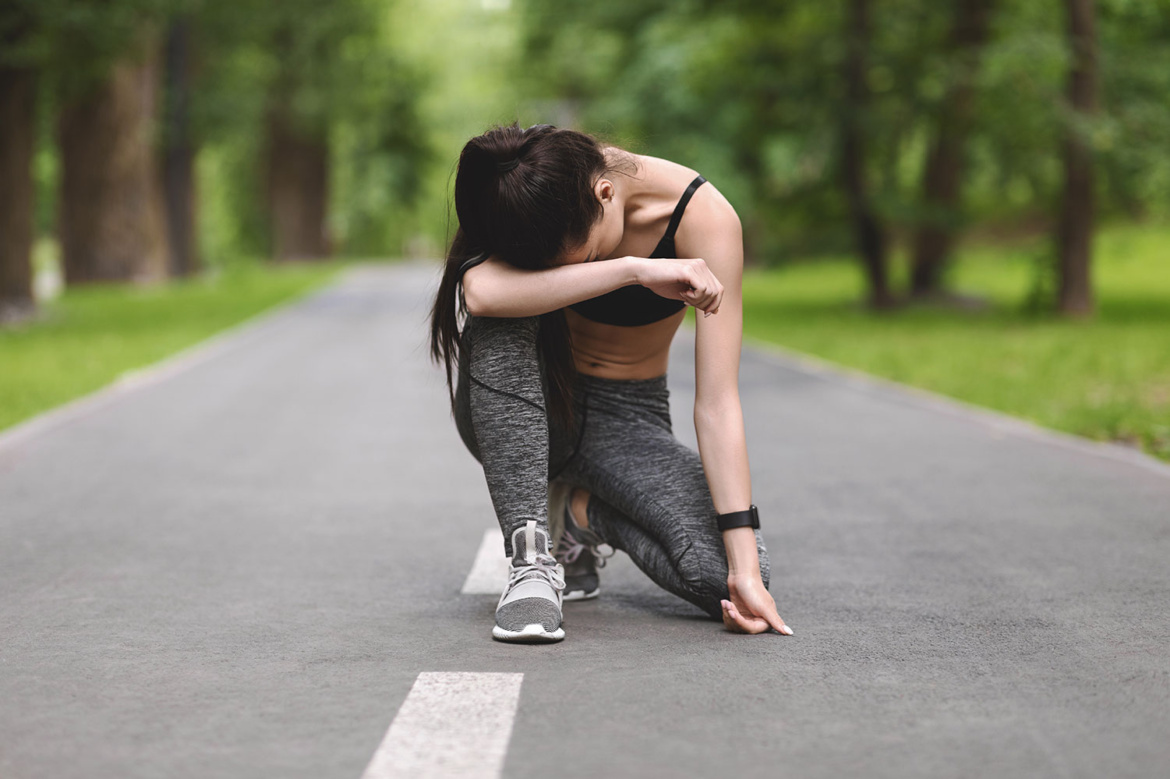 exhausted-asian-jogger-girl-resting.jpg